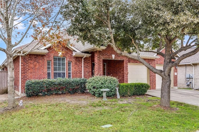 view of front of property with a garage and a front lawn