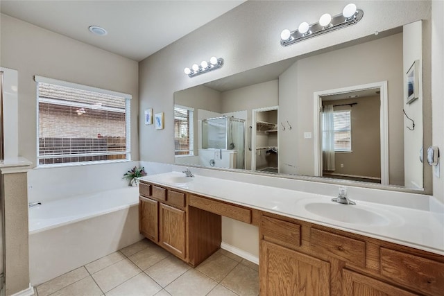 bathroom with separate shower and tub, tile patterned flooring, and vanity