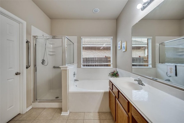 bathroom featuring tile patterned flooring, vanity, and separate shower and tub