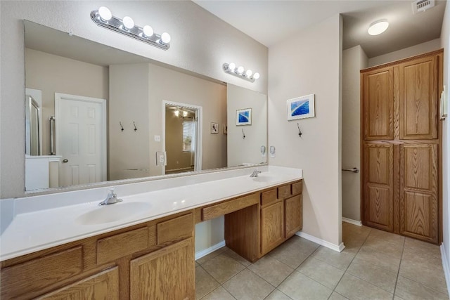 bathroom featuring tile patterned floors and vanity