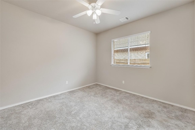 spare room with ceiling fan and carpet floors