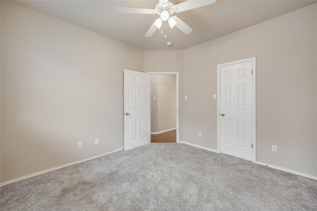 spare room featuring carpet floors and ceiling fan