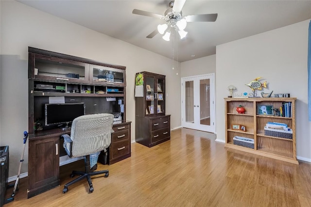 office area with ceiling fan, light hardwood / wood-style floors, and french doors