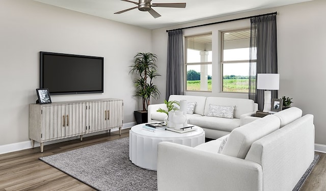 living room with wood-type flooring and ceiling fan