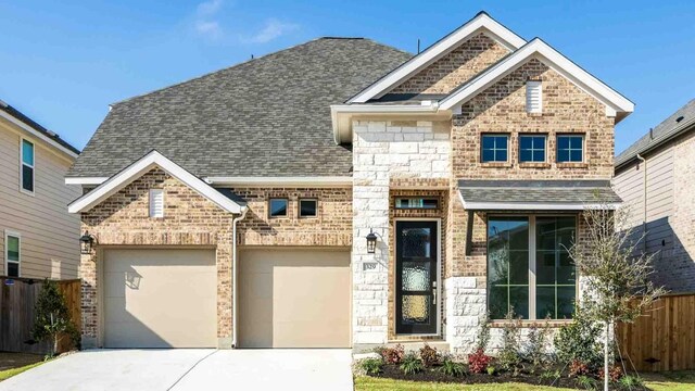 view of front of house featuring brick siding, a shingled roof, an attached garage, fence, and driveway