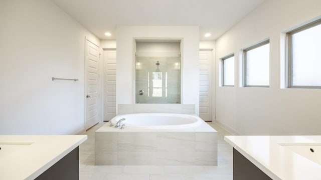 329 Kays Path, Georgetown, TX 78628 - full bathroom featuring vanity, a bath, tiled shower, recessed lighting, and tile patterned floors