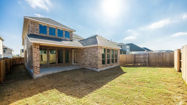 329 Kays Path, Georgetown, TX 78628 - rear view of house featuring brick siding, roof with shingles, and a patio