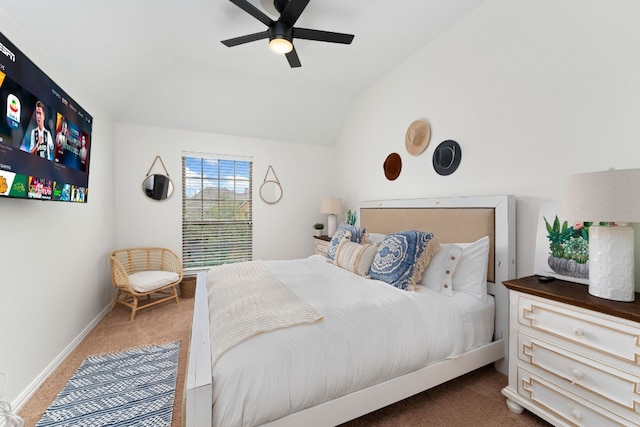 bedroom with lofted ceiling, dark carpet, and ceiling fan