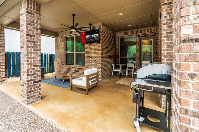 view of patio featuring ceiling fan and a grill