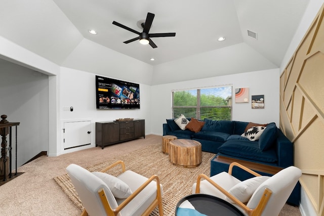 carpeted living room featuring lofted ceiling, a tray ceiling, and ceiling fan