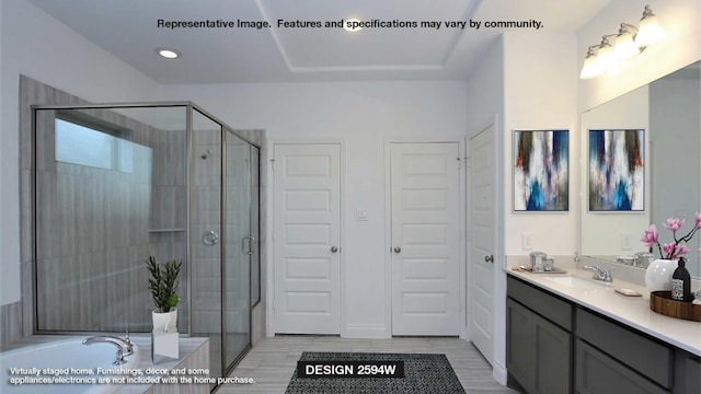 bathroom with shower with separate bathtub and vanity