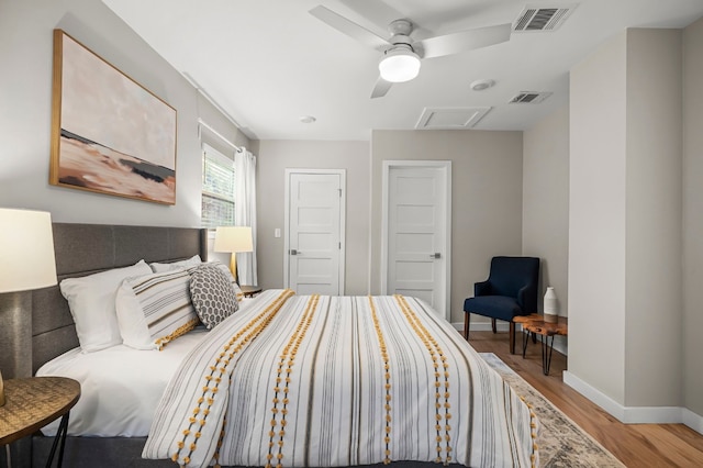 bedroom with ceiling fan and hardwood / wood-style flooring