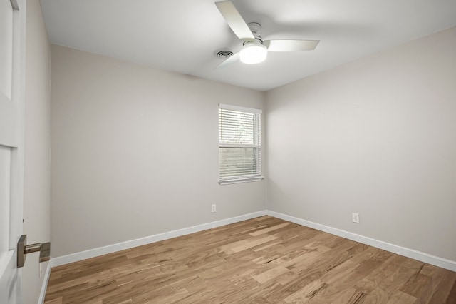 empty room featuring ceiling fan and light hardwood / wood-style floors