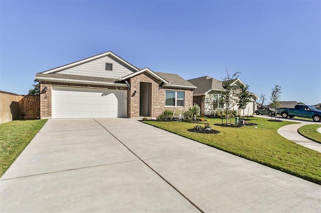 view of front of property featuring a garage and a front yard