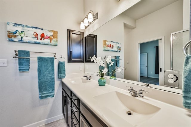 bathroom featuring tile patterned flooring and vanity