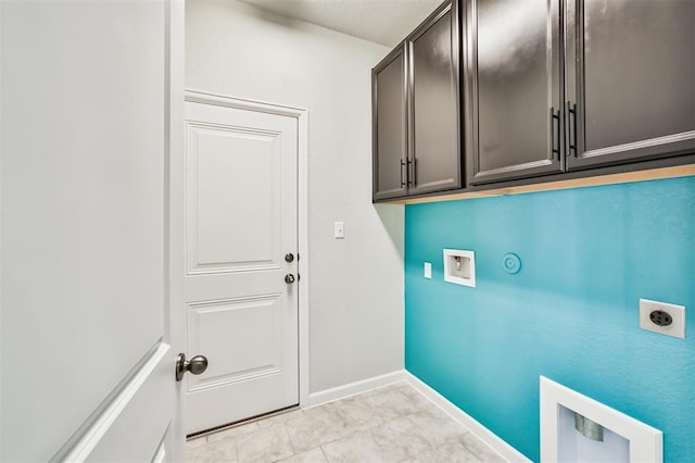 laundry room with electric dryer hookup, gas dryer hookup, cabinets, and washer hookup