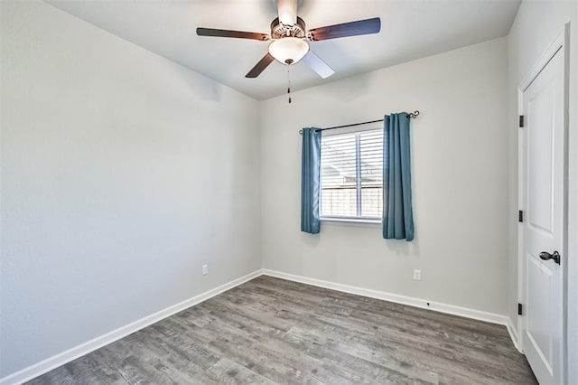 spare room featuring ceiling fan and hardwood / wood-style floors