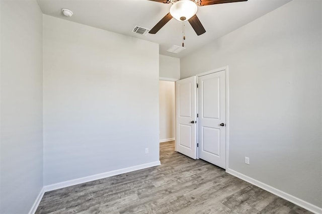 unfurnished bedroom featuring light wood-type flooring and ceiling fan