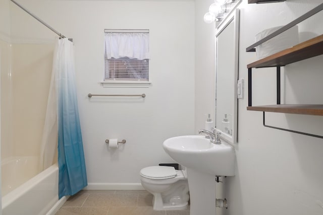 bathroom with tile patterned flooring, shower / tub combo, and toilet