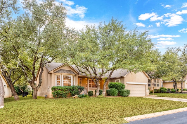 ranch-style home featuring a garage and a front lawn