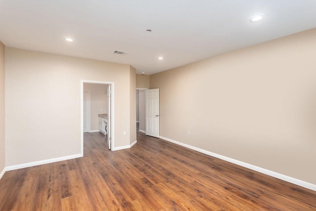 unfurnished bedroom featuring dark wood-type flooring