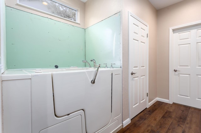 laundry room with dark hardwood / wood-style flooring