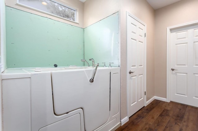 120 Ruellia Dr, Georgetown, TX 78633 - bathroom with a bath, wood finished floors, and baseboards