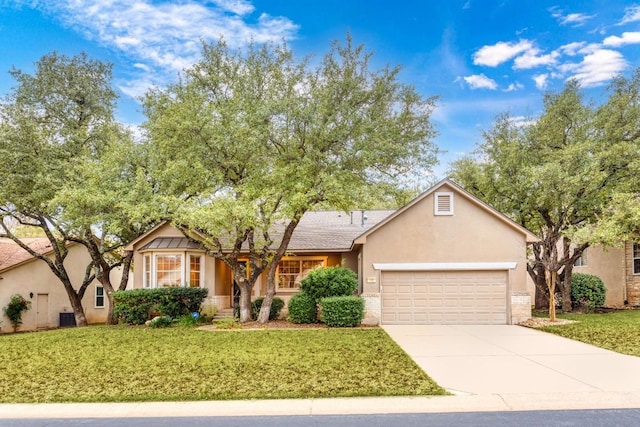 120 Ruellia Dr, Georgetown, TX 78633 - ranch-style house with an attached garage, driveway, a front lawn, and stucco siding