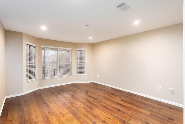 empty room featuring hardwood / wood-style flooring