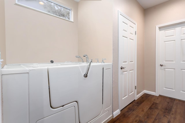 laundry area featuring dark hardwood / wood-style flooring