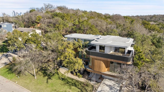 drone / aerial view featuring a view of trees