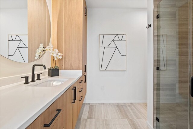 bathroom with vanity and walk in shower