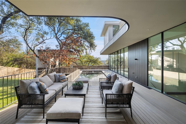 wooden terrace featuring outdoor lounge area