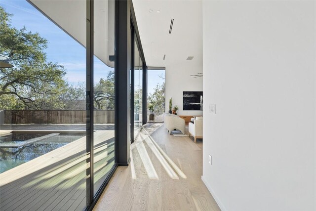 hallway featuring hardwood / wood-style flooring