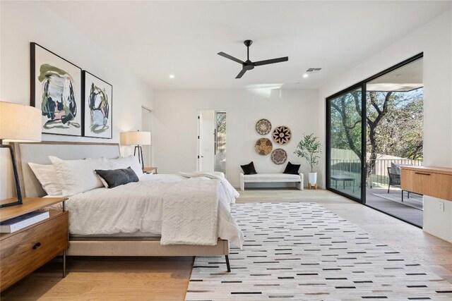 bedroom with ceiling fan, light hardwood / wood-style floors, and access to exterior