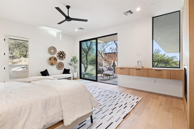 bedroom with ceiling fan, light hardwood / wood-style flooring, and access to outside