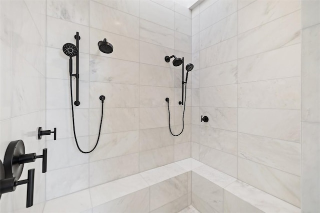 bathroom with tiled shower