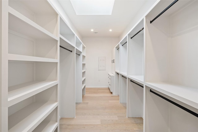 spacious closet featuring light wood-type flooring