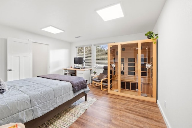 bedroom with hardwood / wood-style flooring