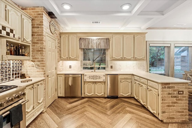 kitchen with appliances with stainless steel finishes, coffered ceiling, sink, beam ceiling, and cream cabinetry