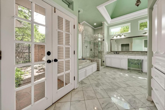 bathroom with french doors, vanity, separate shower and tub, and crown molding