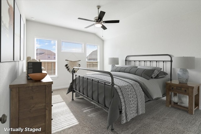 carpeted bedroom with ceiling fan and lofted ceiling