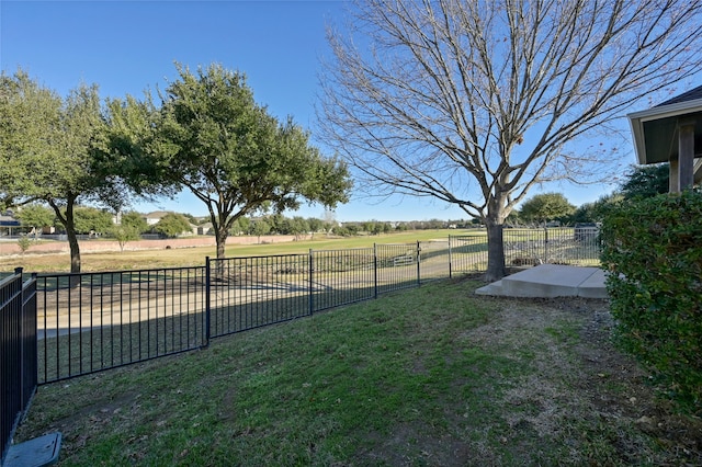 view of yard with a rural view and a patio area