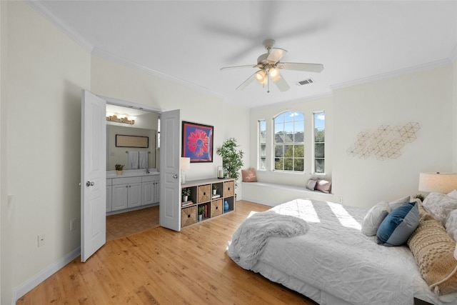 bedroom featuring ensuite bath, ceiling fan, crown molding, and light hardwood / wood-style floors