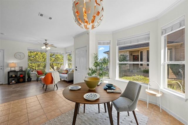 sunroom / solarium with a wealth of natural light and ceiling fan