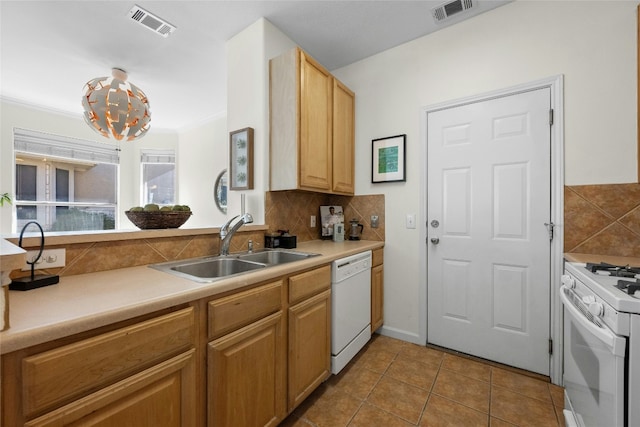 kitchen with light brown cabinets, white appliances, backsplash, sink, and light tile patterned floors