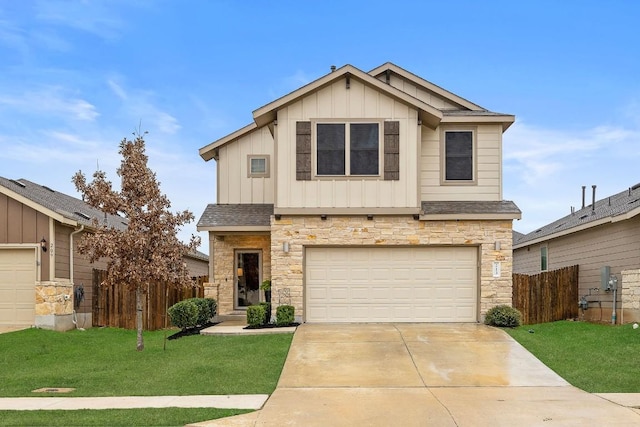 view of front of home featuring a front yard and a garage