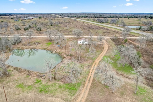 drone / aerial view with a rural view and a water view