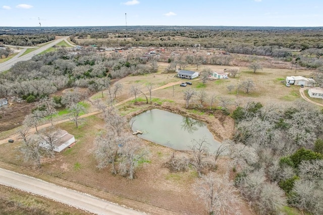 bird's eye view featuring a water view and a rural view