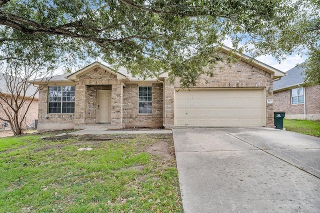 ranch-style house featuring a garage and a front yard